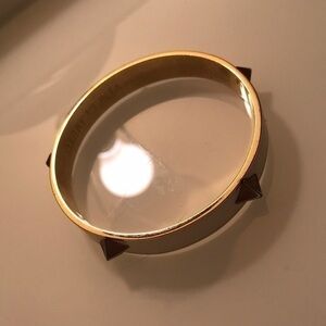 Bracelet gold tone interior with white enamel exterior
